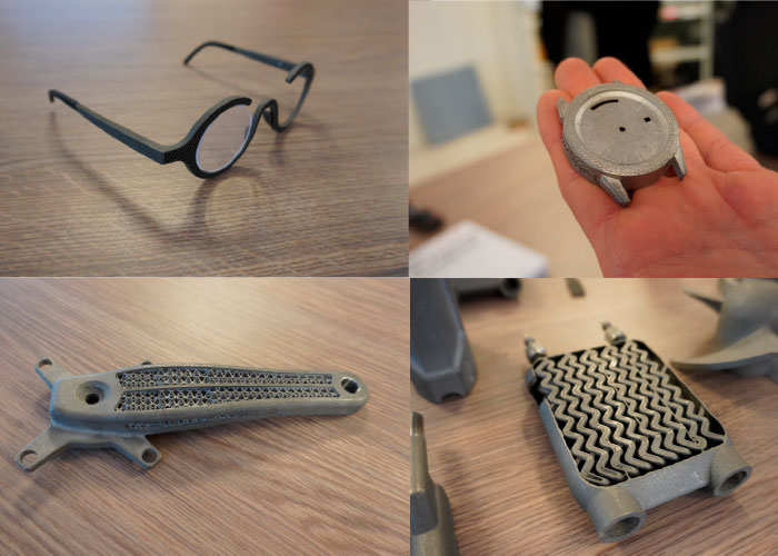 Enkele voorbeelden van 3D-geprinte producten: een bril, een horlogebehuizing, een fietsonderdeel en een warmtewisselaar. 